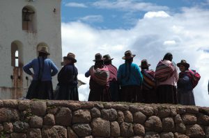 Chincheros residents and church Cusco Peru