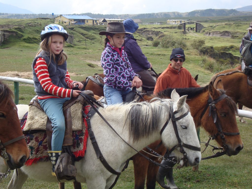 Kids horse riding Cotopaxi Ecuador