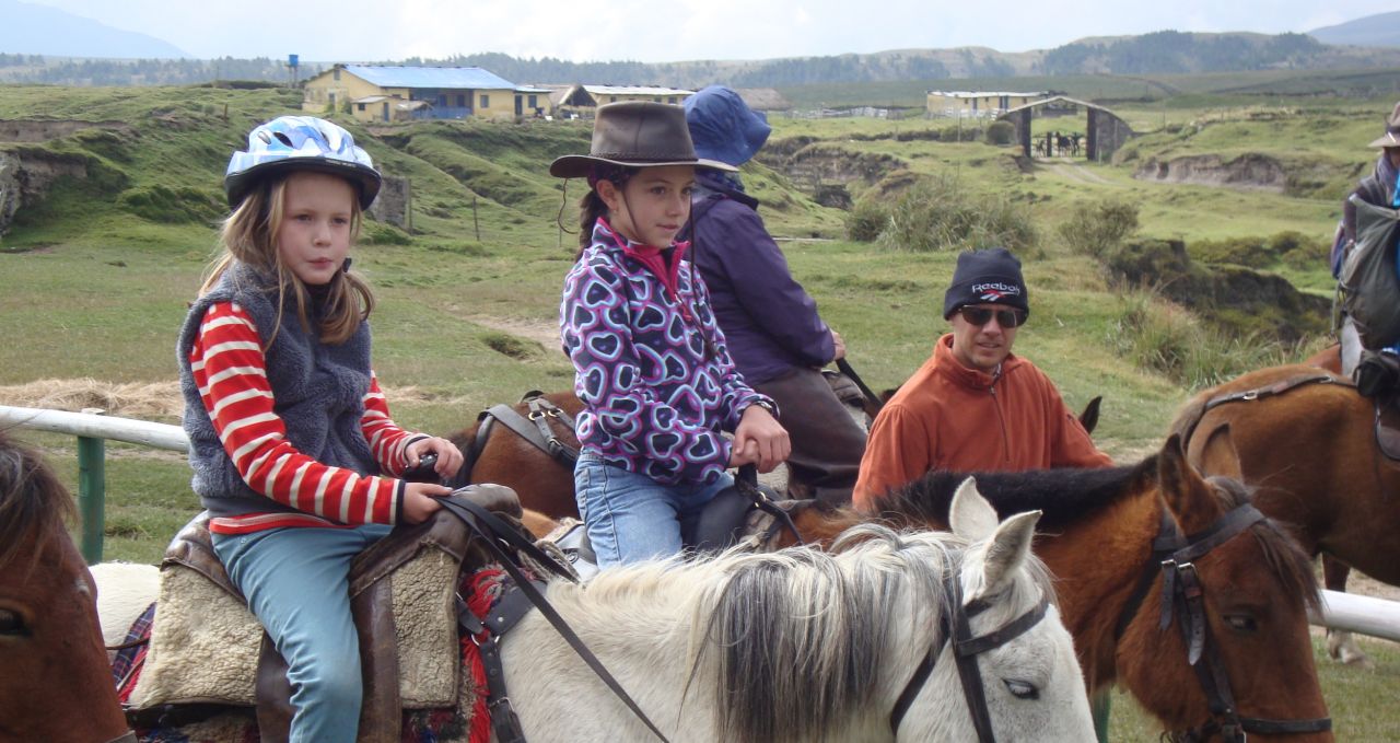 Kids horse riding Cotopaxi Ecuador