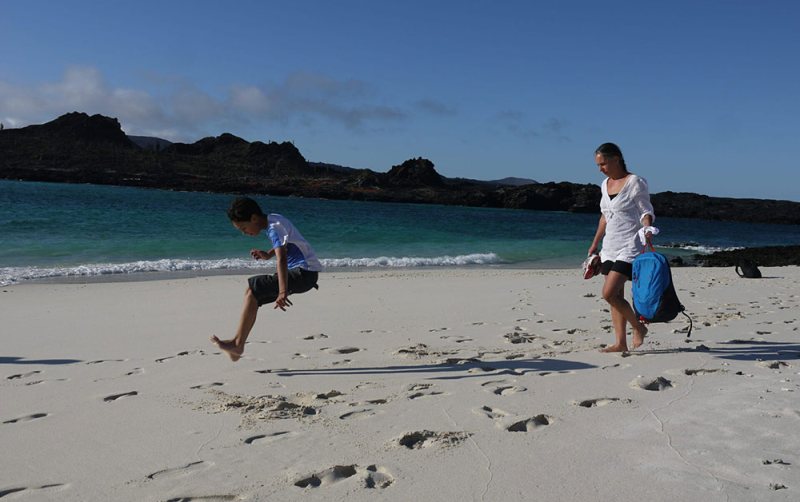 jumping child family holiday galapagos