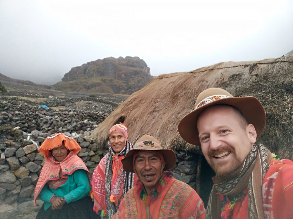 Trekker and andean family, Cancha Cancha, Lares, Peru