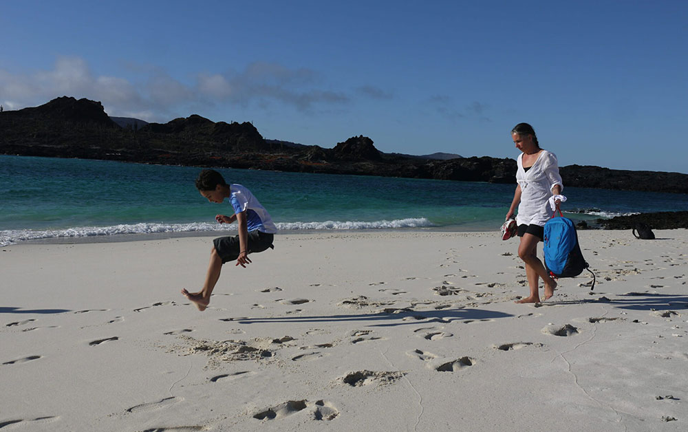 jumping child family holiday galapagos