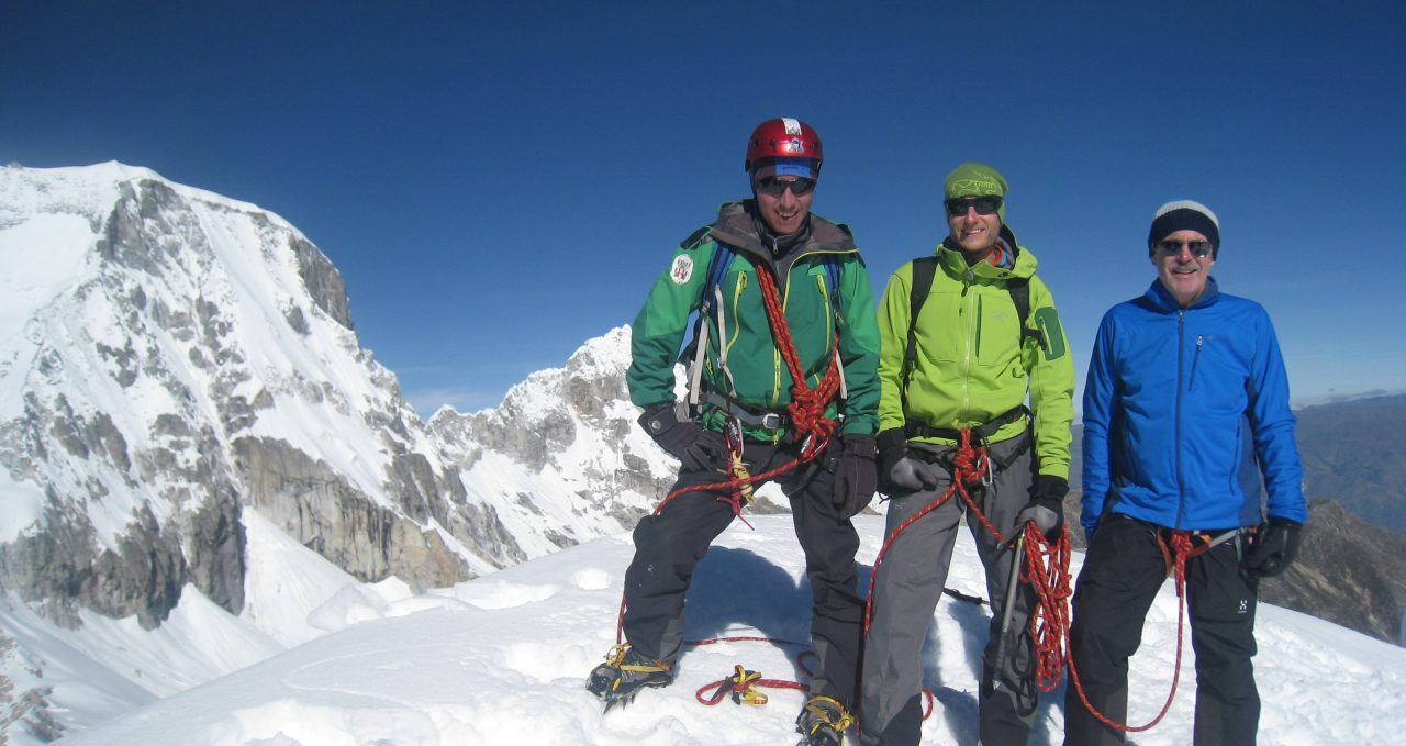 Climbers on Ishinca summit, Cordillera Blanca, Peru