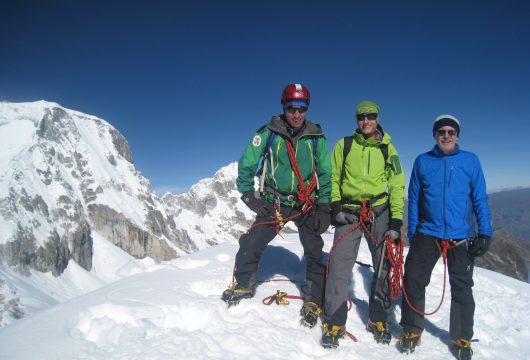 Climbers on Ishinca summit, Cordillera Blanca, Peru