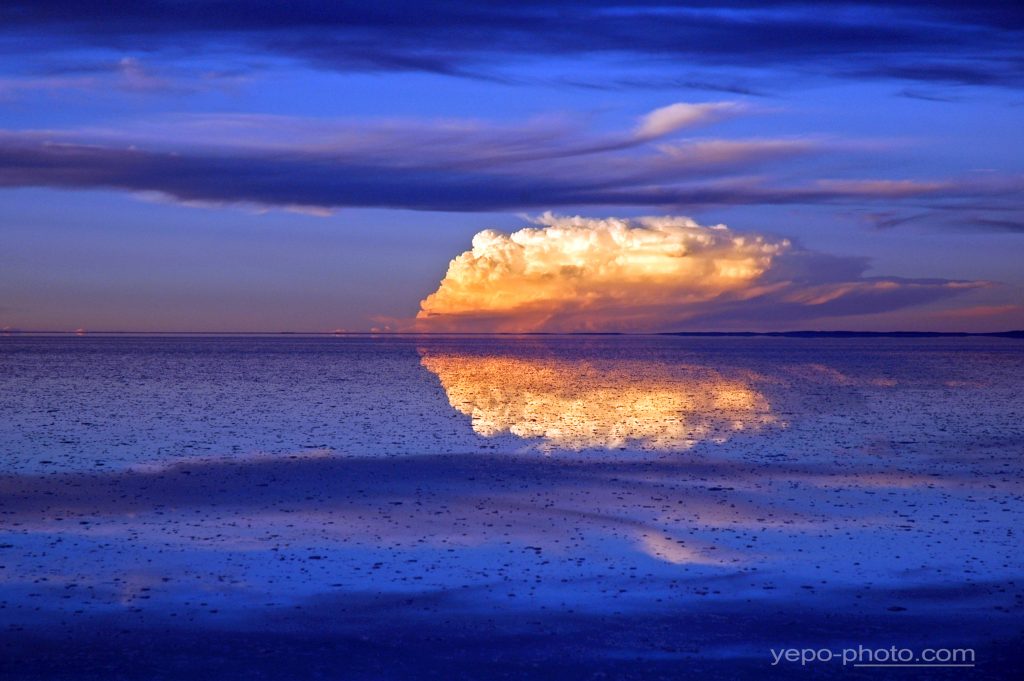 El Salar de Uyuni cloud and sunlight Bolivia