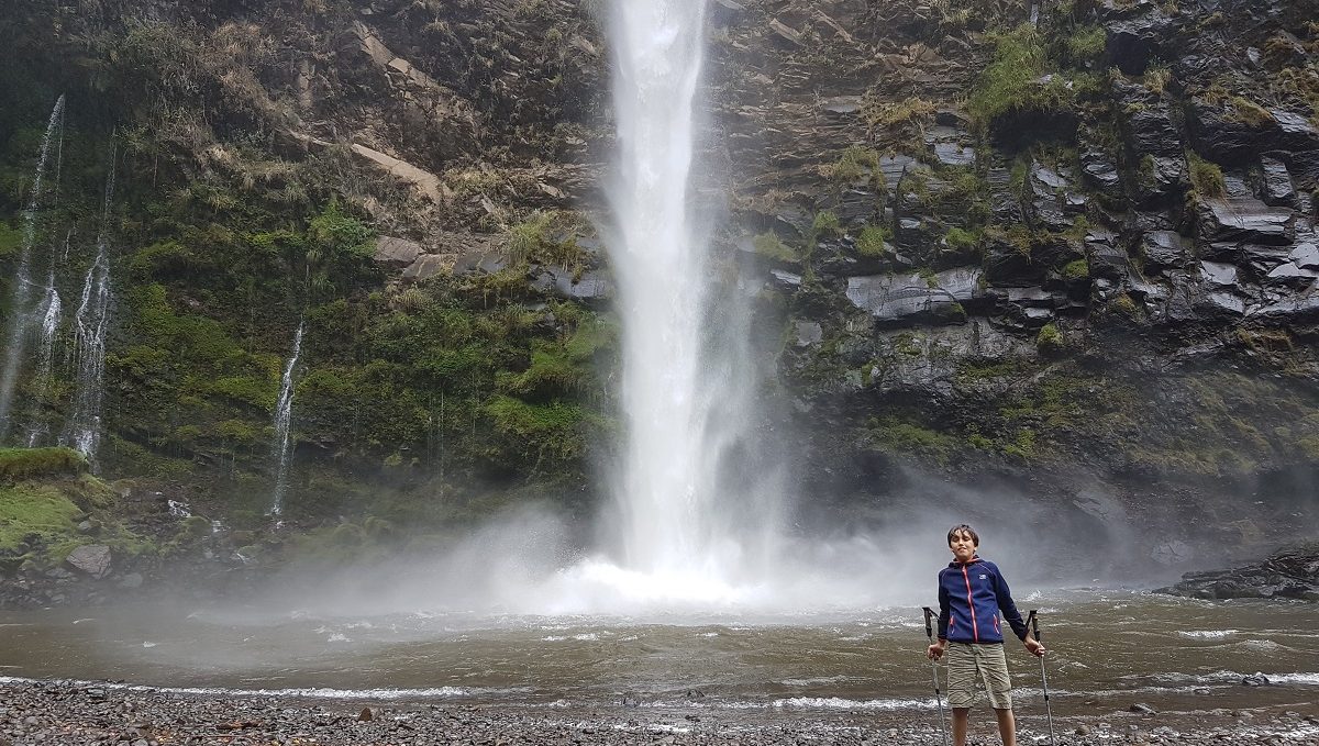 kid and waterfall on ecuador trekking trip