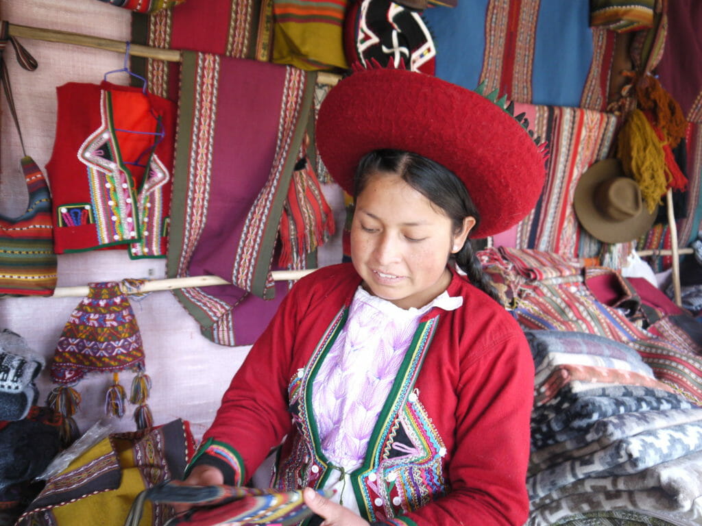 Weaver in traditional dress, Peru