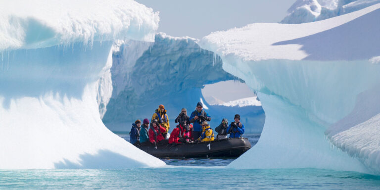Zodiac and iceberg Antarctica 21 cruise