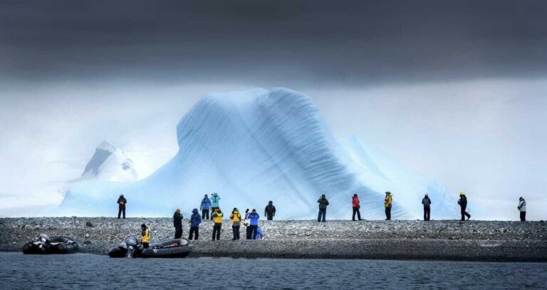 people and iceberg antarctica