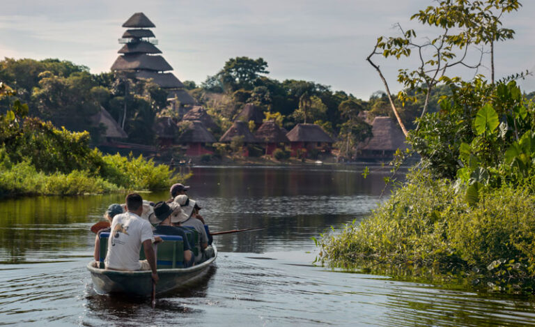 Canoe arriving at Napo lodge Napo Ecuador