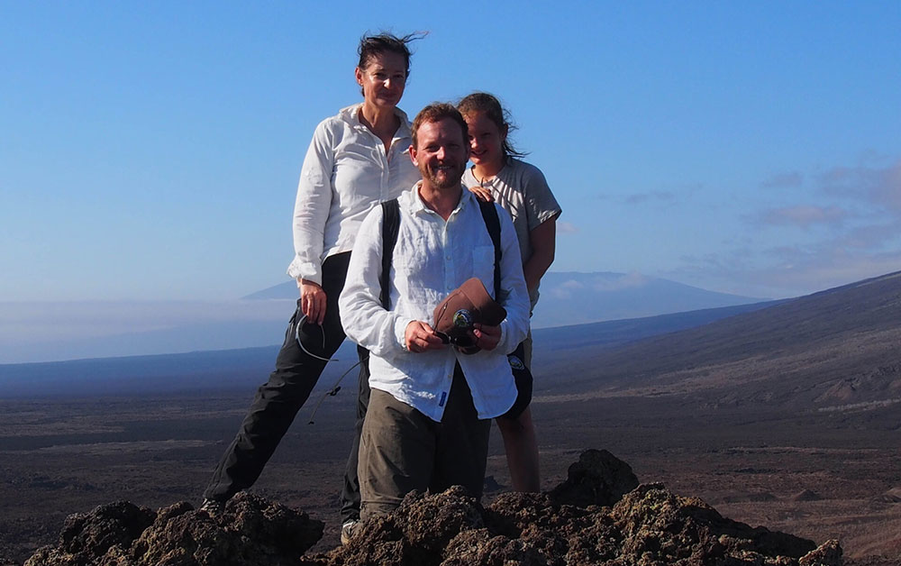 Family on volcano Galapagos