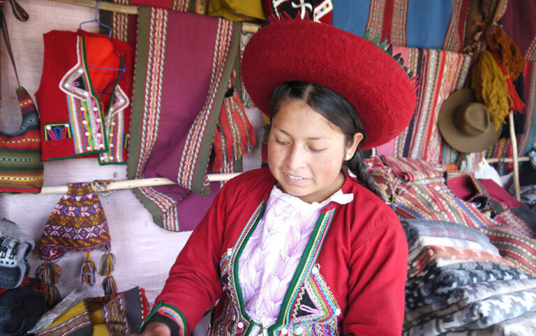 Weaver in traditional dress Peru