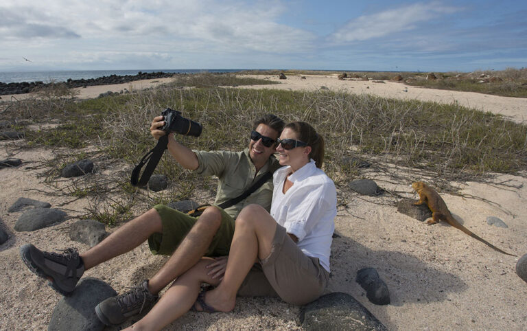finch bay selfie with land iguana galapagos