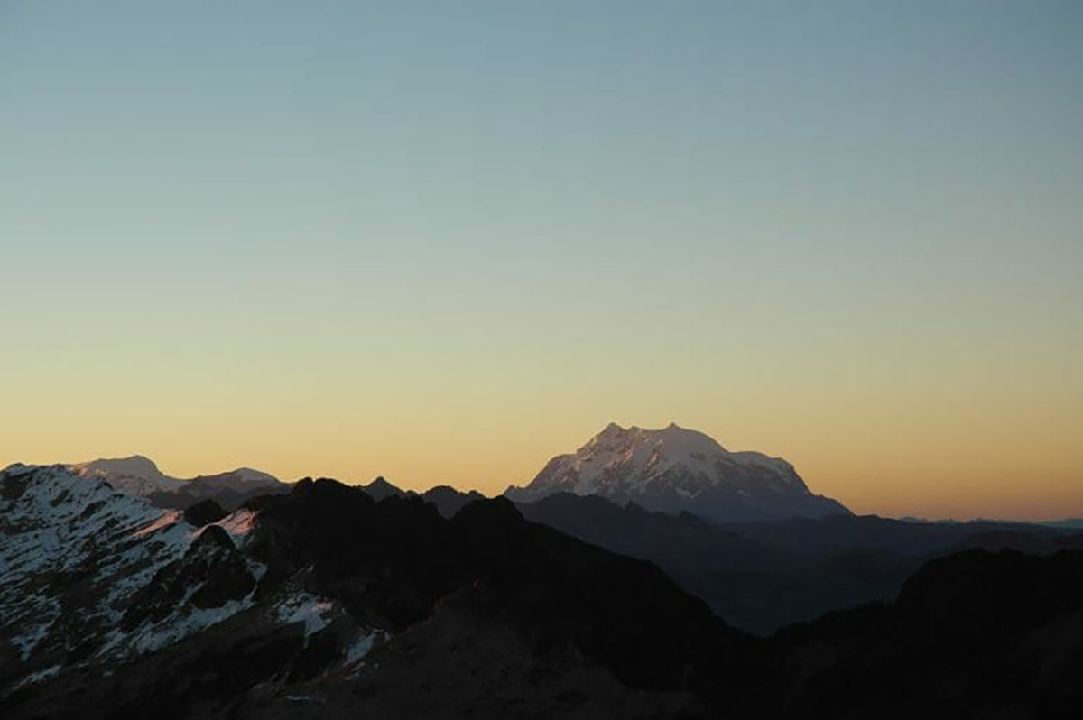 Sun rise over Illimani Bolivian Andes
