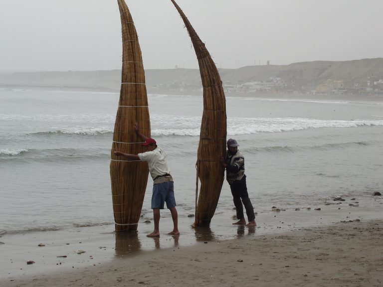 Fishermen with Totora reed boats, Huanchaco
