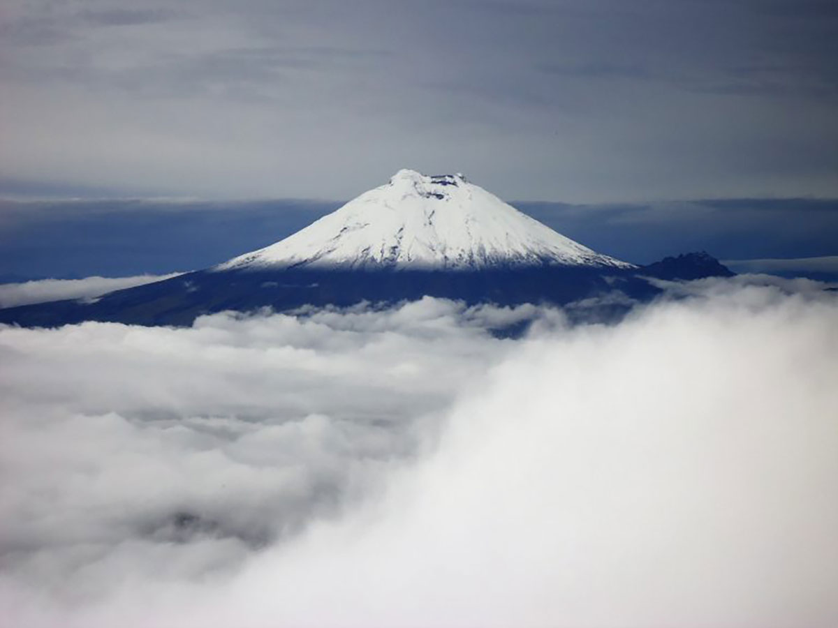 Cotopaxi above clouds Ecuador