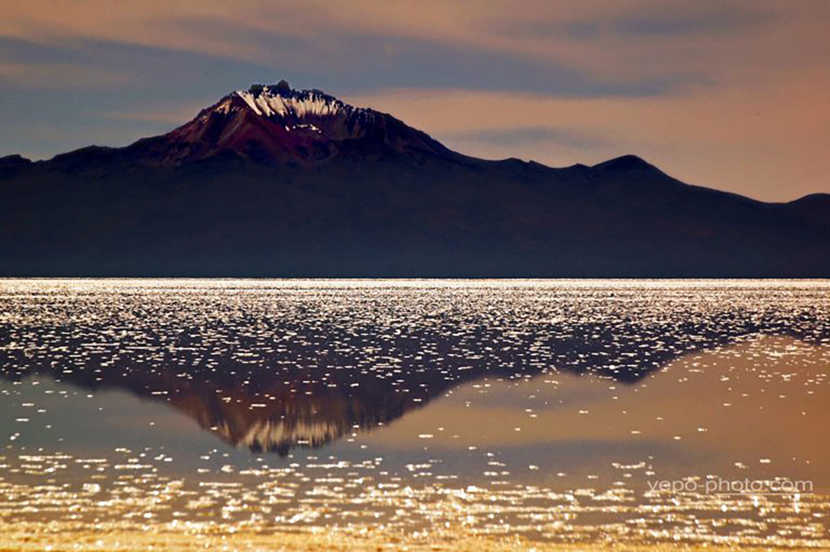 El Salar De Uyuni Tunupa Mountain Reflected Bolivia