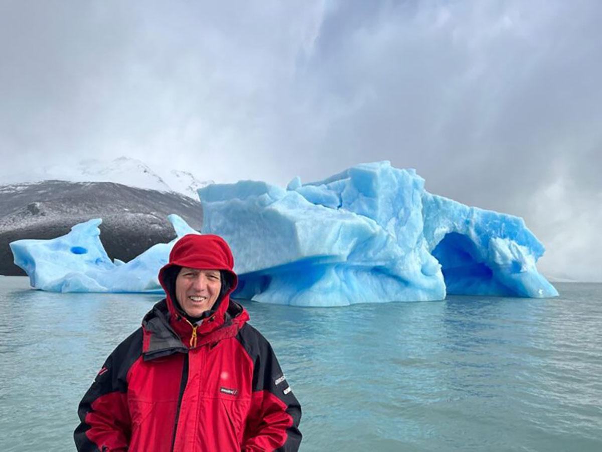 Man in front of large chunks of ice