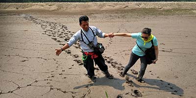 Tambopata Research Centre guide and mud and traveller, Peru
