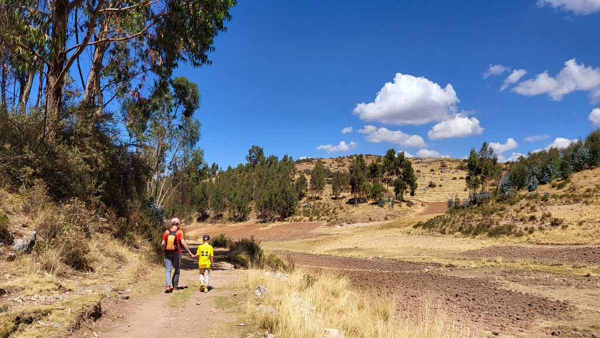 Hiking downhill past ruins to Cusco
